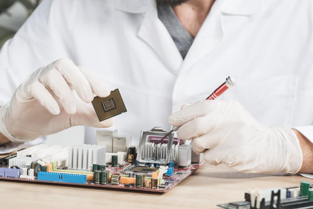 Close up male technician holding computer chip